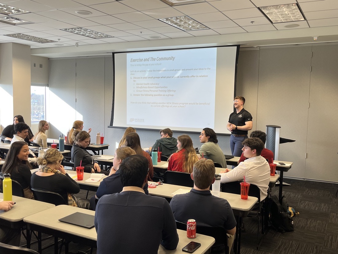 Jared presenting on exercise and community